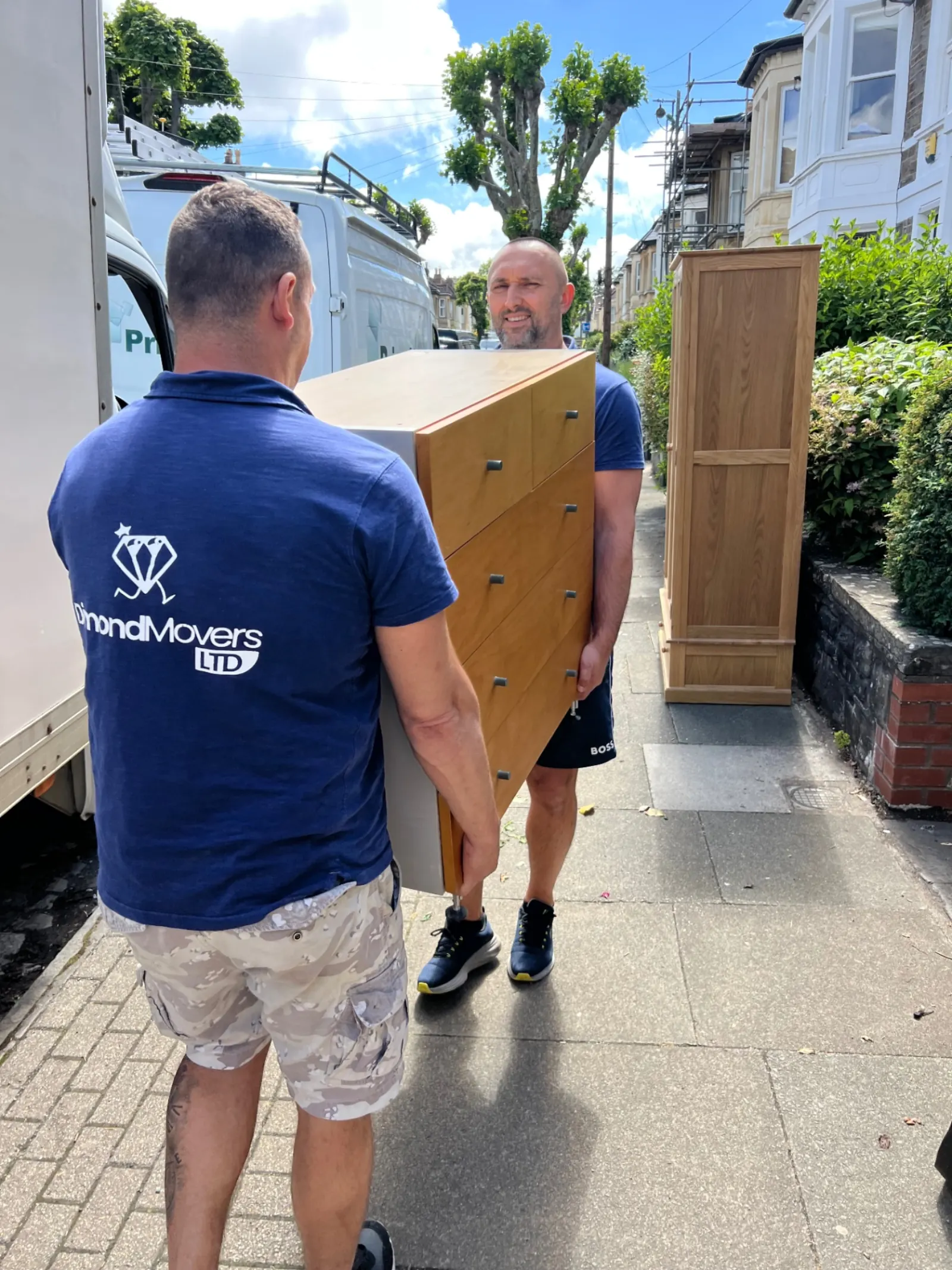 Real Dimond Movers crew loading furniture into a branded Luton van during a house removal in Oxfordshire