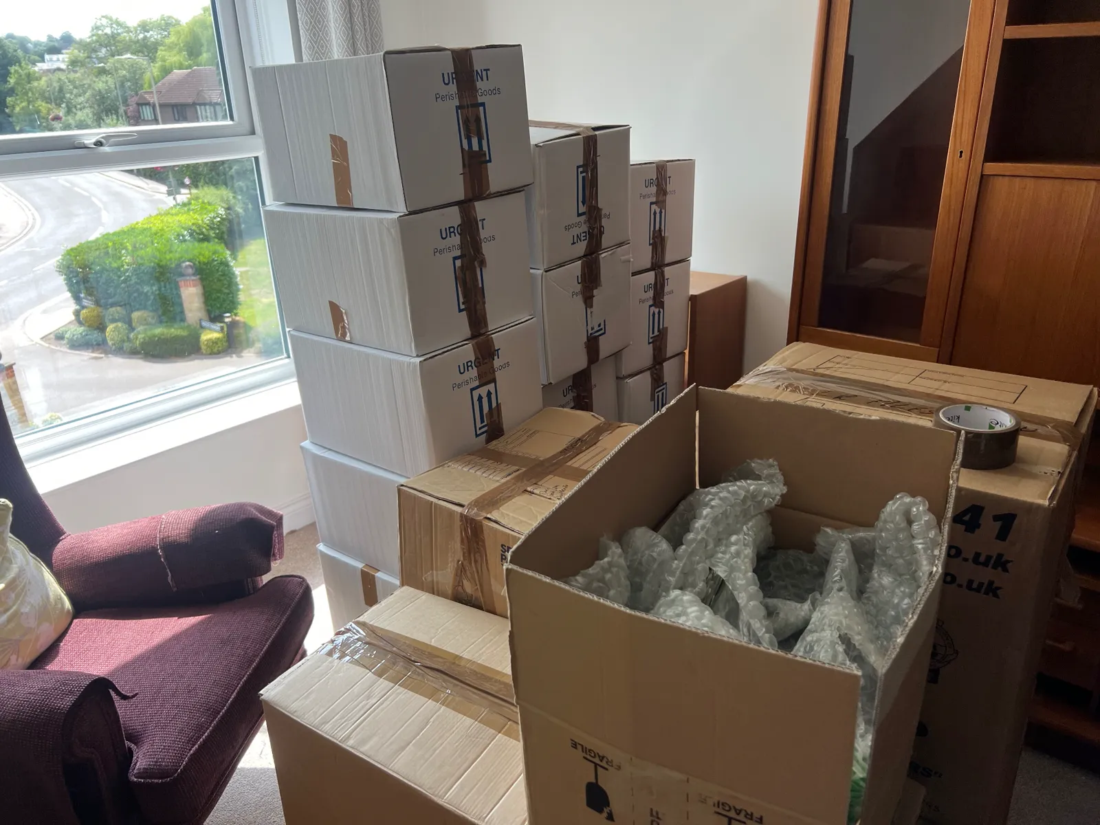 Labelled packing boxes stacked and ready for a Dimond Movers house removal in Oxfordshire