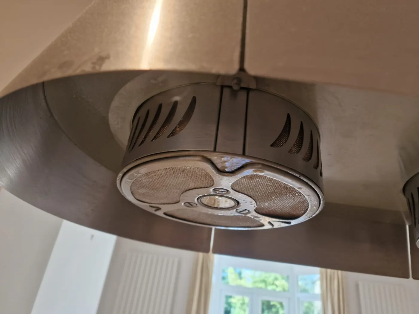 Close-up of kitchen extractor mesh filters mid-degrease