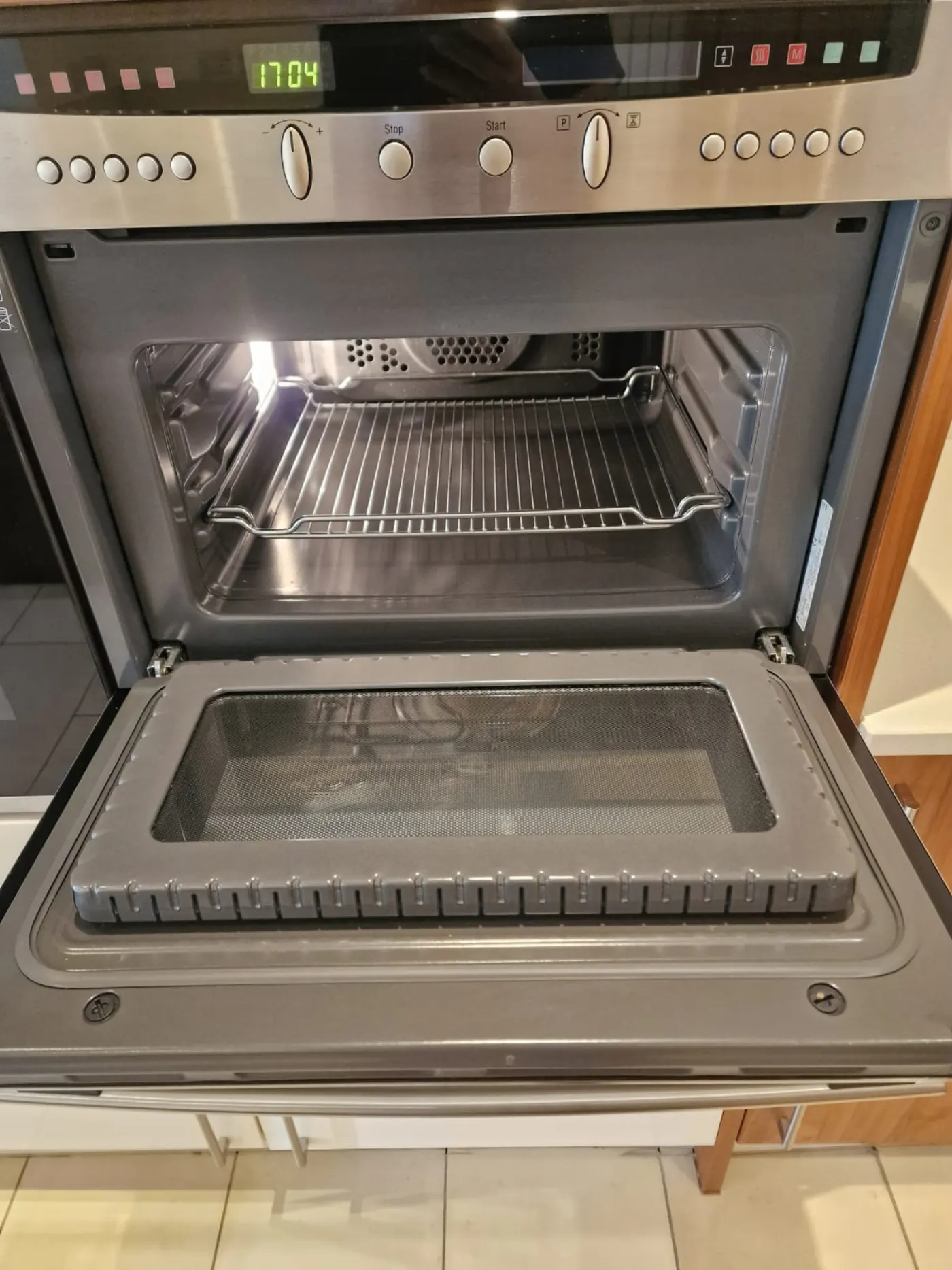 Combination microwave oven cleaned inside and out for end of tenancy handover