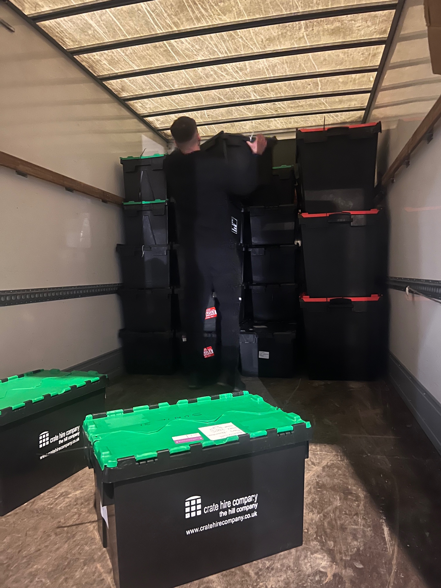 Office crates organised inside the Dimond Movers van ready for delivery